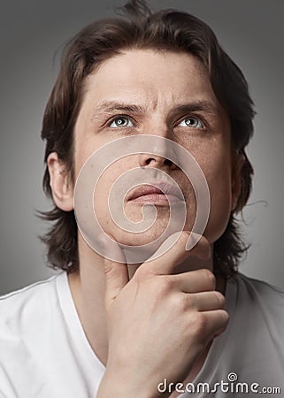 Portrait of a pensive handsome man Stock Photo