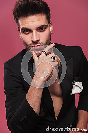 Portrait of pensive man wearing an undone black tuxedo Stock Photo