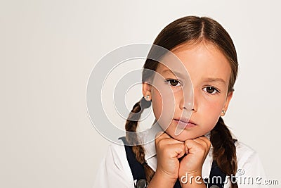 portrait of pensive schoolkid with hands Stock Photo