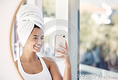 portrait, phone selfie and woman, towel and bathroom for skincare, beauty and cleaning in mirror reflection. Face, girl Stock Photo
