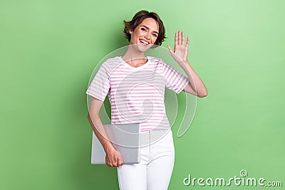 Portrait photo of young adorable pretty smiling woman hold laptop from work showing high five palm hello employer Stock Photo