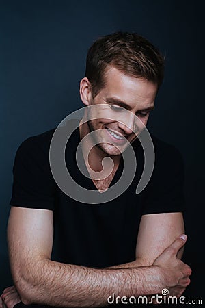 Portrait photo of young happy man with a blinding smile Stock Photo