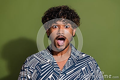 Portrait photo of young hispanic funny man in summer shirt amazed open mouth cant believe your words isolated on khaki Stock Photo