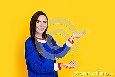 Portrait photo of young smiling woman satisfied demonstrate two fresh vegetables promoter hypermarket isolated on yellow Stock Photo