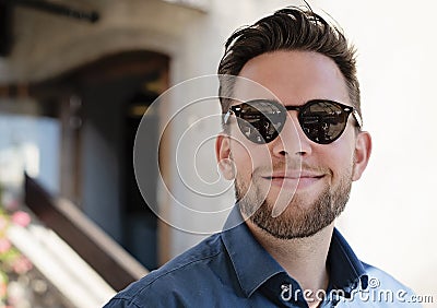 Portrait picture of young handsome man with glasses smiling Stock Photo