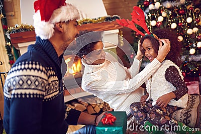 Portrait of playful family and child during Christmas Stock Photo
