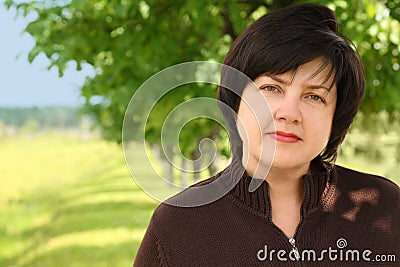 Portrait of plumpy adult brunette woman Stock Photo