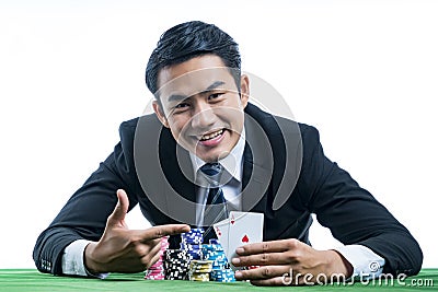 Portrait the poker gambler use finger pointing to a pair of aces Stock Photo