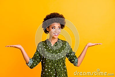 Portrait of positive cheerful afro american girl hold hand look want choose decide ads promo recommend sales discounts Stock Photo