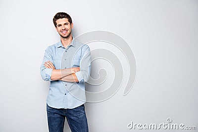 Portrait of positive cheerful cool college university man cross hand feel like true leader person wear denim jeans style Stock Photo