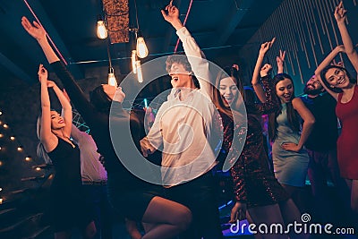 Portrait of positive cheerful couple visit event party dance feel wild crazy rejoice enjoy weekends nightlife event have Stock Photo