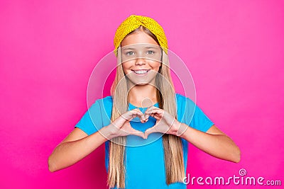 Portrait of positive cheerful funky child make heart from her fingers show affection passion feeling love to her mother Stock Photo