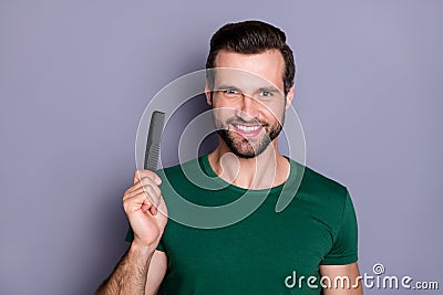 Portrait of positive cheerful guy demonstrate hairbrush enjoy anti dander haircare procedure wear good look outfit Stock Photo