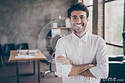Portrait of positive cheerful middle eastern entrepreneur cross his hands feel real successful start-up owner in Stock Photo
