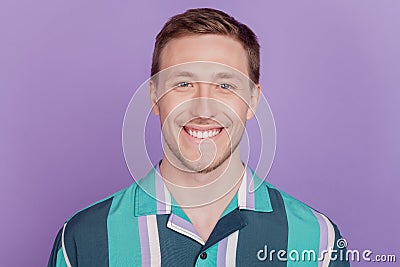 Portrait of positive cherful nice attractive guy toothy beaming smile on violet background Stock Photo