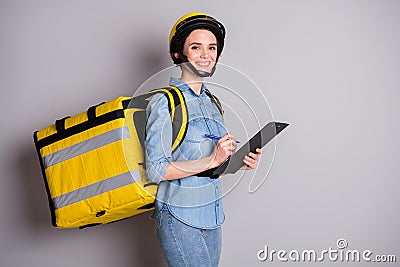 Portrait of positive courier girl hold clip board write check list enjoy deliver meal pizza home carry thermal backpack Stock Photo