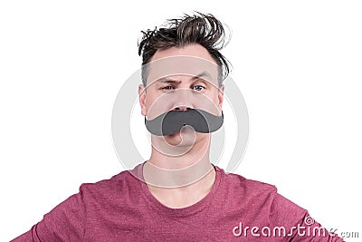 Portrait of a positive man with cardboard mustache and arched eyebrow, isolated on white background Stock Photo