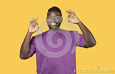 Portrait Of Positive Young Black Man Showing Ok Gesture, Studio Stock Photo