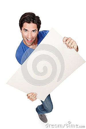 Portrait, poster or happy man with a board for promotion, marketing or advertising deal in studio. Above, offer or male Stock Photo