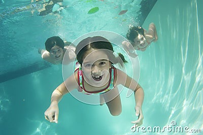 Portrait of a preadolescent children swimming underwater Stock Photo