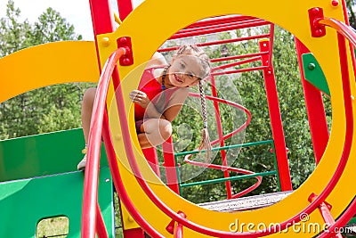 Portrait of preschool caucasian girl playing on the playground Stock Photo