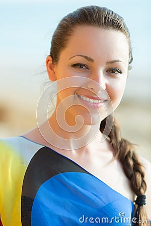 Portrait of pretty girl with braid in asymmetrical dress Stock Photo