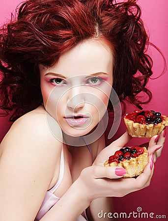 Portrait of pretty girl eating cake, close up Stock Photo