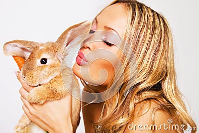 Portrait of a pretty girl with a rabbit Stock Photo