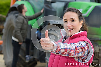 Portrait pretty and happy farmer thumb-up Stock Photo