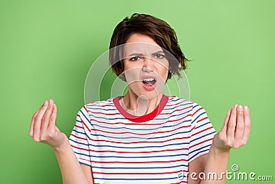 Portrait of pretty mad fury girl having fight saying claim bad mood isolated over green pastel color background Stock Photo