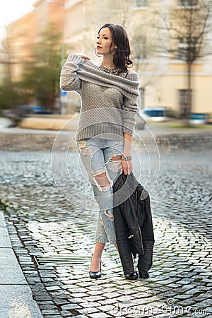 Portrait pretty sensual woman in coat posing in the city Stock Photo