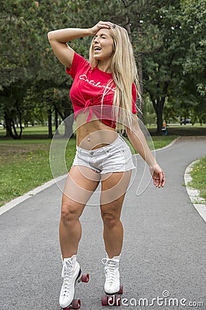 Picture of pretty sporty woman in roller skates Stock Photo