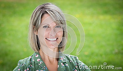Portrait Of A Pretty Woman Smiling In The Forest. Isolated on green Stock Photo