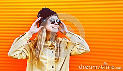 Portrait pretty woman wearing a black hat and headphones l Stock Photo