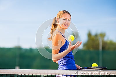 Portrait of a pretty young tennis player Stock Photo