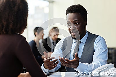 Professional black businessman consulting client at legal firm Stock Photo