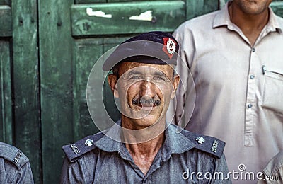 Portrait of proud elderly policeman in Peshawa Editorial Stock Photo