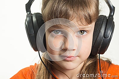 Portrait of purposeful girl with headphones Stock Photo