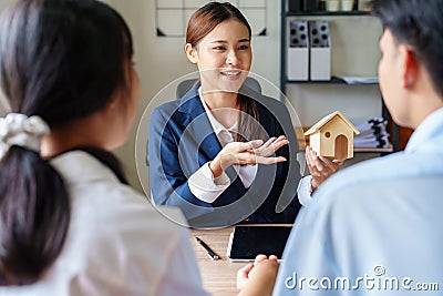 Portrait of a real estate agent or bank officer, the lending department quotes the interest on the loan to the customer Stock Photo