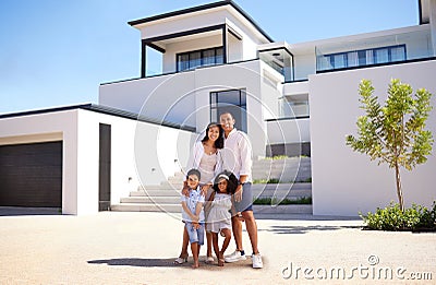 Portrait, real estate and happy family moving into their new luxury home, house or property in summer. Happy parents and Stock Photo