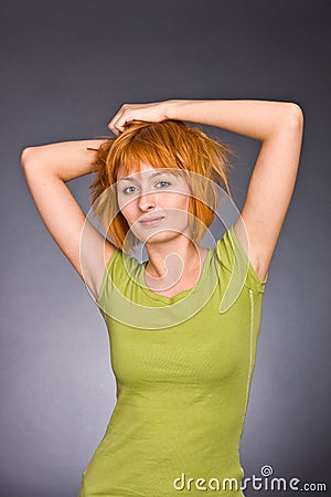 Portrait of the red-haired girl in a green T-shirt Stock Photo