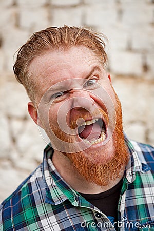 Portrait of red haired man expressing a emotion Stock Photo