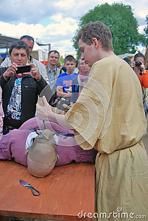 Portrait of reenactor, he performs a medical doctor doign a surgery Editorial Stock Photo