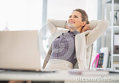 Portrait of relaxed business woman in office Stock Photo