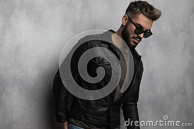 Portrait of relaxed casual man with sunglasses looking to side Stock Photo