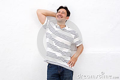 Relaxed middle adult man leaning over white background Stock Photo