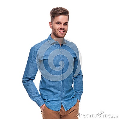 Portrait of relaxed young casual man standing and smiling Stock Photo