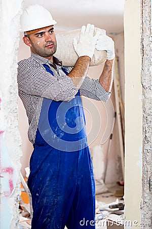Portrait of repairer man with package of plaster Stock Photo