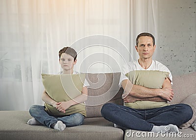 Offended father and son are silent after conflict Stock Photo