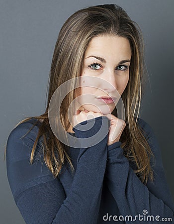 Portrait of a reserved young beautiful girl acting introvert Stock Photo